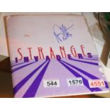 Press pack for Strange Invaders signed to cover, containing photographic prints and five slides. P&P