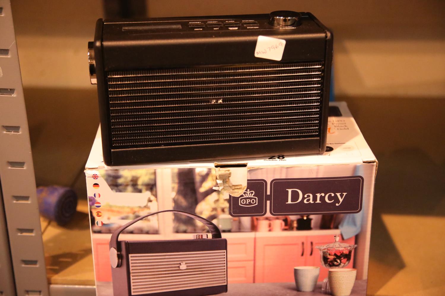 Black GPO Darcy a portable analogue FM / AM radio with alarm clock. Preset 20 radio stations.