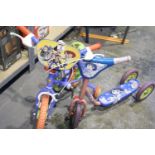 Child's Toy Story bike with stabilizers and a Dora the Explorer scooter. Not available for in-