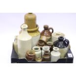 Collection of vintage stoneware jars and bottles including Bols decanter. Not available for in-house