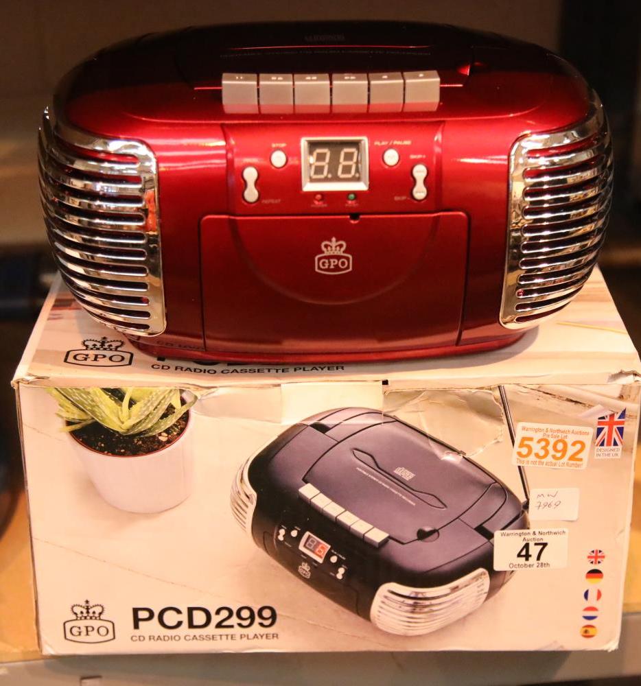 Red, 3-in-1 FM/AM Radio, CD and Cassette player, boxed. GPO PCD299. In working order. Not