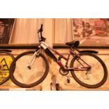 Red Raleigh MT Explore bike with 18 inch frame and 26 inch wheels. Not available for in-house P&P