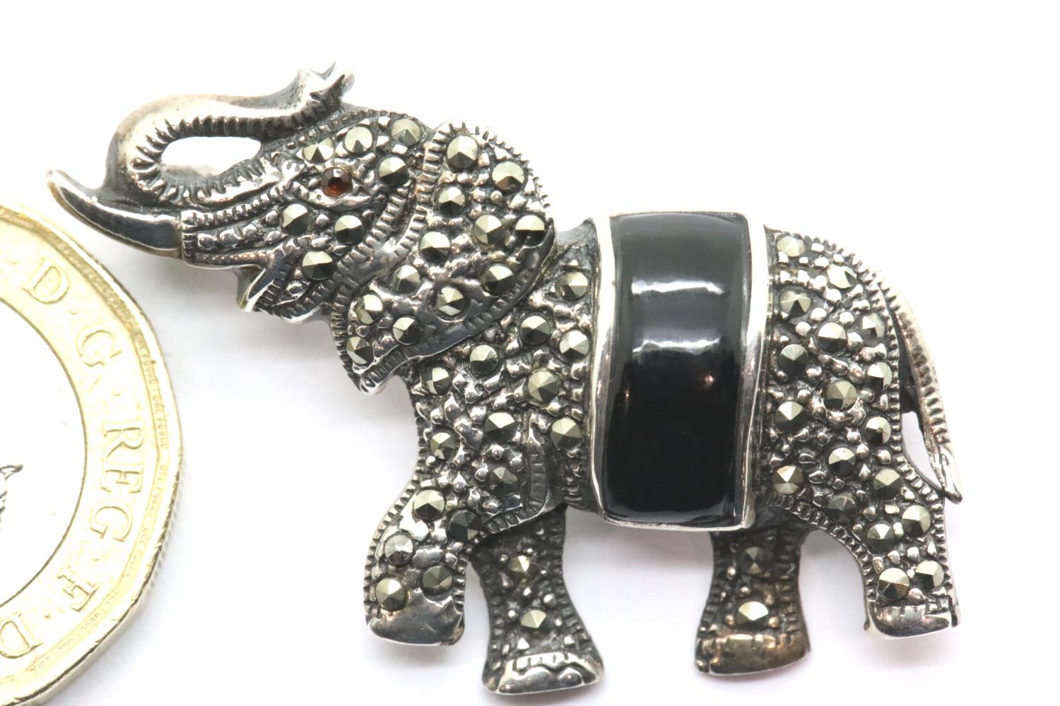 Silver marcasite and enamel elephant brooch, L: 3 cm, 8g. P&P Group 1 (£14+VAT for the first lot and