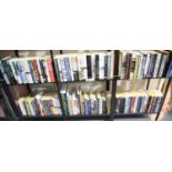 Six shelves of military related paperback non-fiction books. Not available for in-house P&P