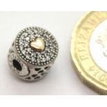 14ct gold diamond set Pandora charm, 2.6g. P&P Group 1 (£14+VAT for the first lot and £1+VAT for