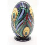 Moorcroft peacock feather egg with red dot, H: 11 cm. P&P Group 2 (£18+VAT for the first lot and £