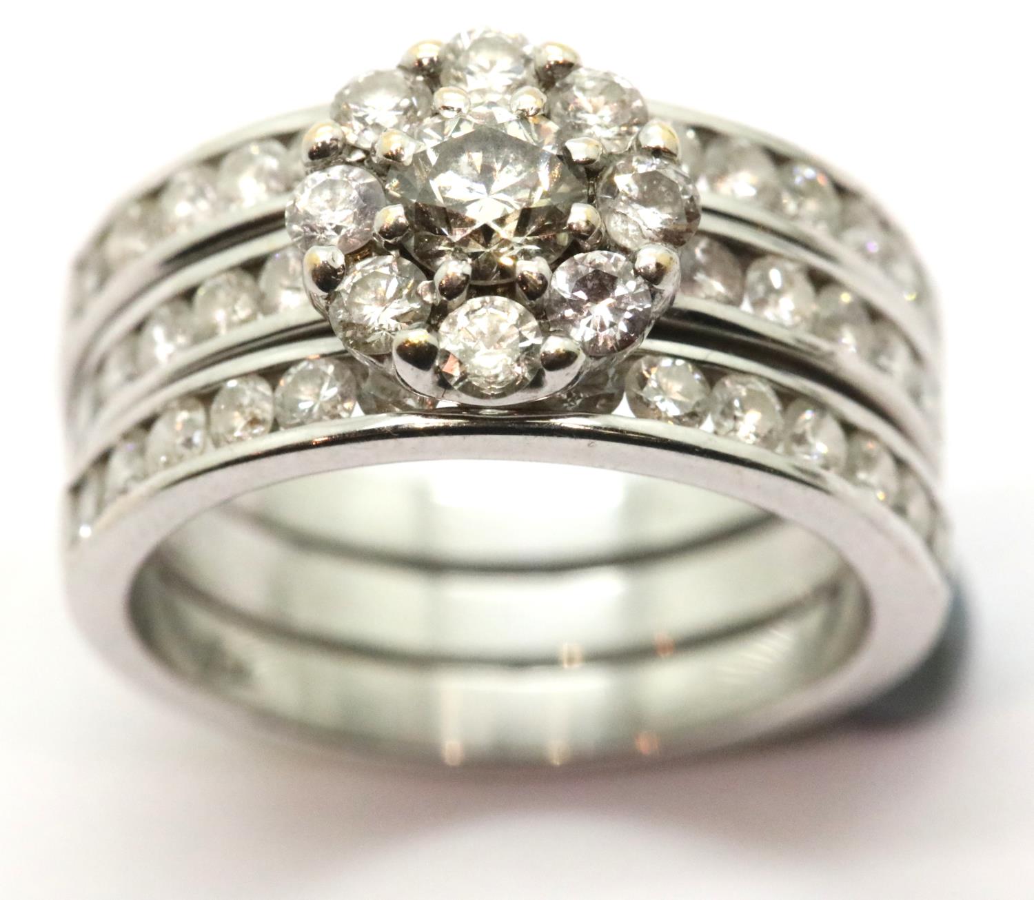 Combined wedding and engagement rings with three rows of diamonds in 18ct white gold. Central