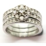 Combined wedding and engagement rings with three rows of diamonds in 18ct white gold. Central