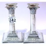 Pair of hallmarked silver weighted columnar candlesticks, H: 12 cm, Birmingham assay. P&P Group