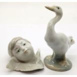 Two Lladro figurines, a goose and cherub. P&P Group 2 (£18+VAT for the first lot and £3+VAT for