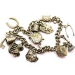 Silver charm bracelet with 13 charms, L: 16 cm, 45g. P&P Group 1 (£14+VAT for the first lot and £1+
