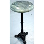 Cast iron tripod table with a circular marble top, H: 60 cm. Not available for in-house P&P.