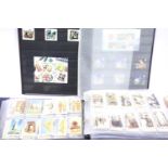 Album containing multiple sets of cigarette cards and a part filled stamp stock book. P&P Group