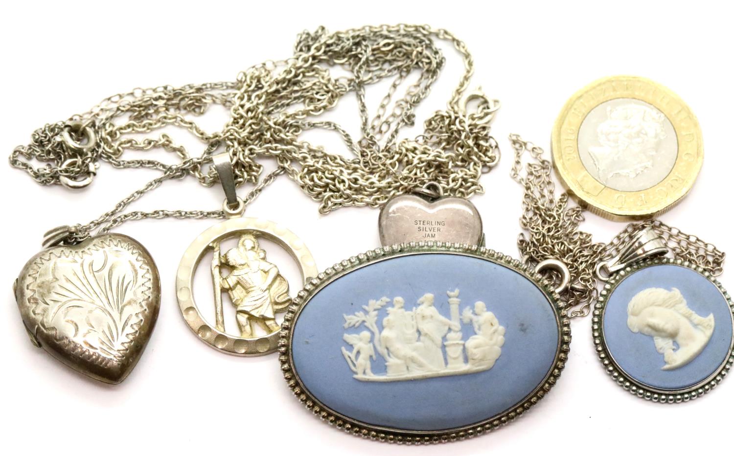 Four silver pendants with chains and a Wedgwood brooch. P&P Group 1 (£14+VAT for the first lot