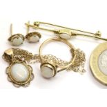 9ct gold suite of opal jewellery comprising a pendant, brooch, ring and earrings. P&P Group 1 (£14+
