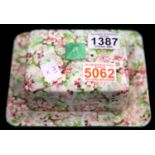 Shelley Chintz butter dish. P&P Group 2 (£18+VAT for the first lot and £2+VAT for subsequent