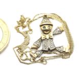 9ct gold jewel set articulated clown pendant on a fine chain, 3.7g. P&P Group 1 (£14+VAT for the