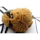 Vintage hand carved tagua nut Dragonball netsuke on beaded cord. P&P Group 1 (£14+VAT for the