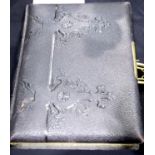 Victorian leather brass bound photograph album with floral decorated pages and gilt edging. P&P