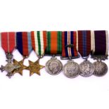 Miniature bar of WWII and later medals, including MBE. P&P Group 2 (£18+VAT for the first lot and £