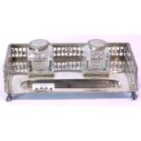Hallmarked silver desk stand having two cut glass inkwells and pen recess, galleried, the inkwell