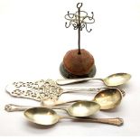 Hallmarked silver hatpin holder, three silver spoons and a white metal server. P&P Group 2 (£18+
