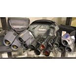 Six pairs of compact binoculars, all in good working order; Bresser, Bushnell, Chinon, Olympus,