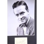 Bob Hope, framed signature with publicity shot photograph, 24 x 19 cm, with no CoA. P&P Group 2 (£