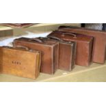 Five vintage leather suitcases. Not available for in-house P&P