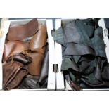 Two boxes of brown leather pieces. P&P Group 3 (£25+VAT)