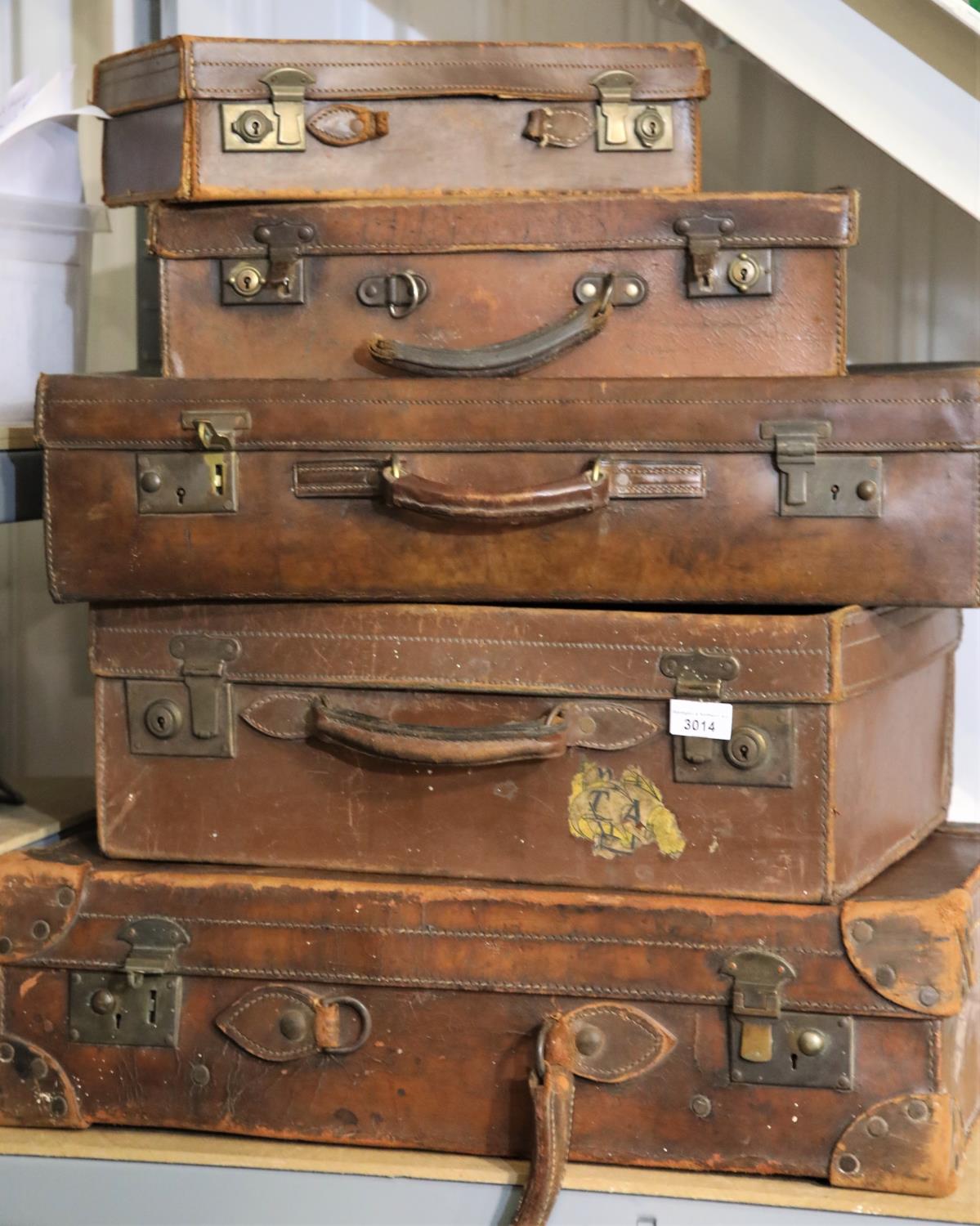 Five vintage leather suitcases, largest 60 x 40 cm. Not available for in-house P&P