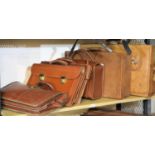 Two vintage leather suitcases, a pilot's case and three briefcases. Not available for in-house P&P