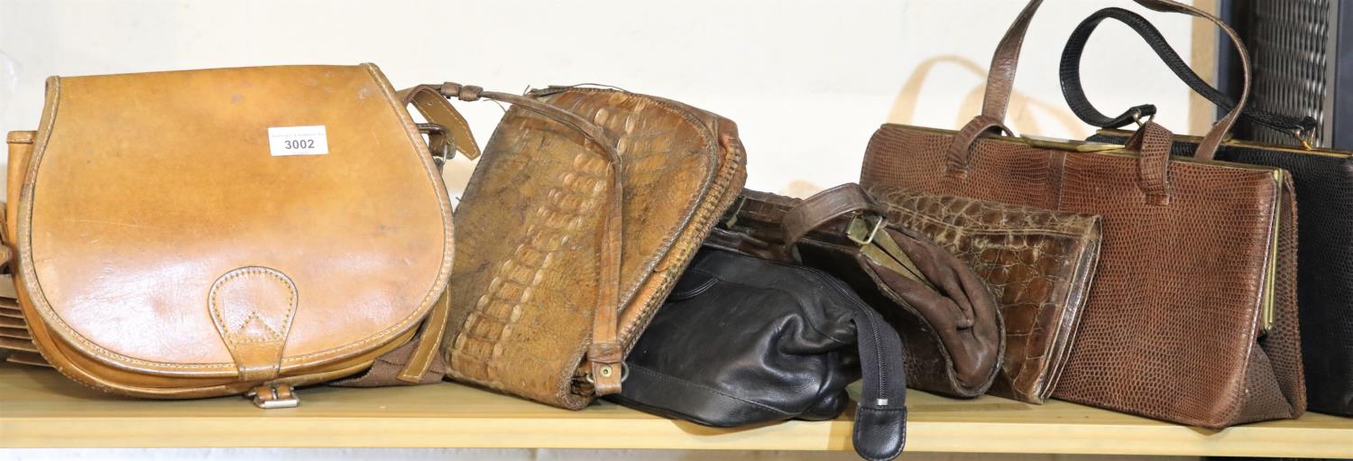 Six mixed ladies handbags including crocodile and a fishing creel. P&P Group 3 (£25+VAT)