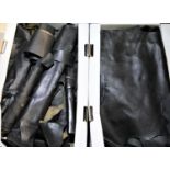 Two boxes of black leather pieces. P&P Group 3 (£25+VAT)