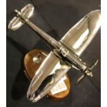 Chrome Spitfire on wooden base, H: 21 cm. P&P Group 2 (£18+VAT for the first lot and £3+VAT for