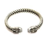 White metal Tibetan silver twisted bangle with heavy dragon finials. P&P Group 1 (£14+VAT for the