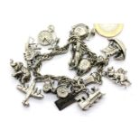 Charm bracelet with 12 charms, unmarked, 48g. P&P Group 1 (£14+VAT for the first lot and £1+VAT