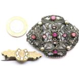 Vintage belt buckle set with pearls and purple stones and a Victorian bar brooch faced with yellow