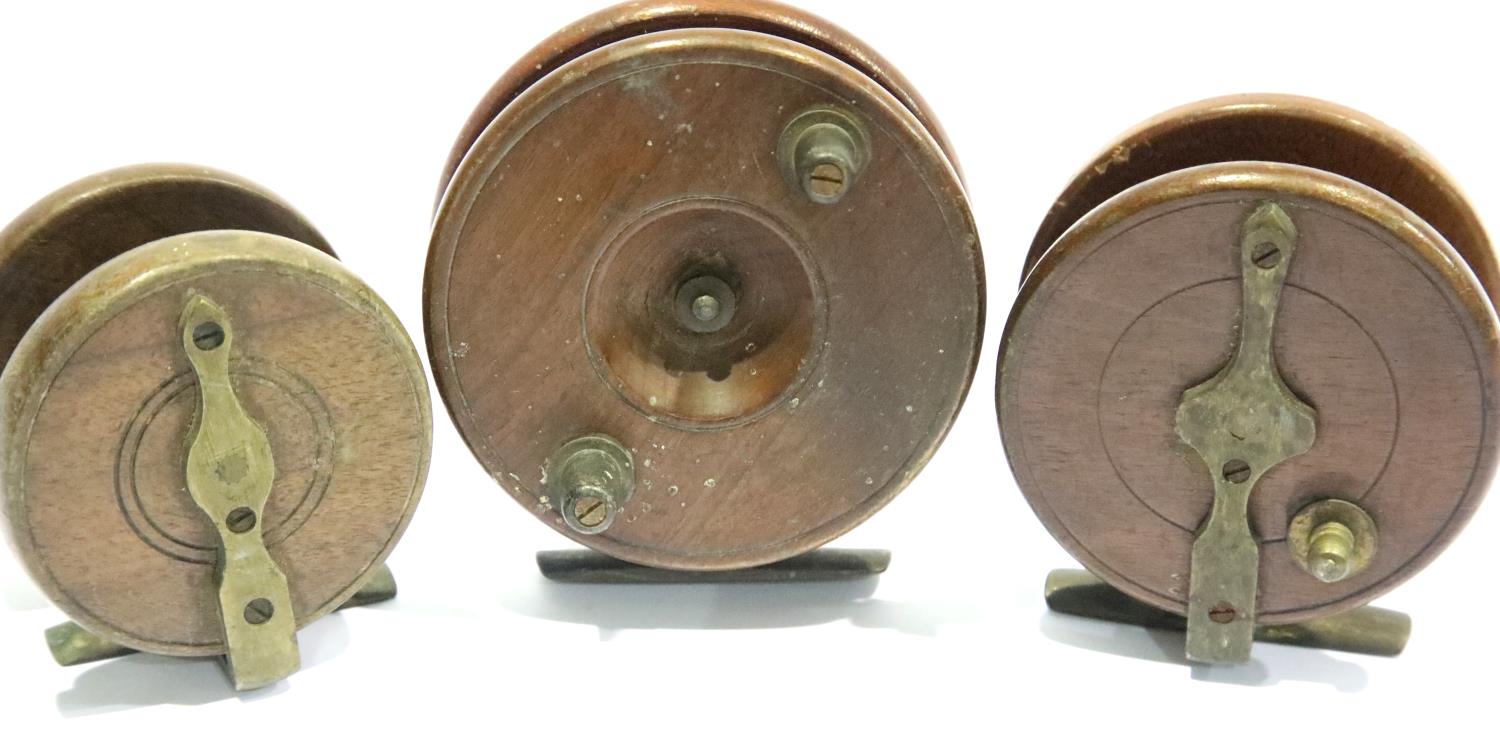 Three wood and brass centre pin fishing reels, two marked Made in England, one S Allcock & Co. P&P - Image 2 of 2