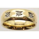 9ct gold gypsy band set with three diamonds, 7.9g, size Q. P&P Group 1 (£14+VAT for the first lot