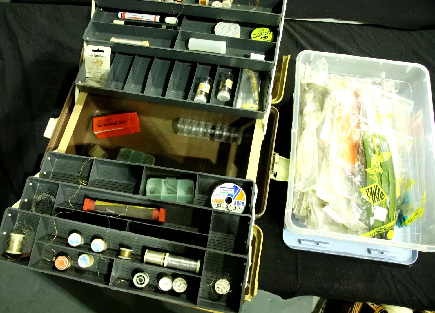 Box of coloured feathers and a tackle box of fly tying items. Not available for in-house P&P