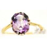Unmarked yellow metal amethyst ring, size H, 2g. P&P Group 1 (£14+VAT for the first lot and £1+VAT