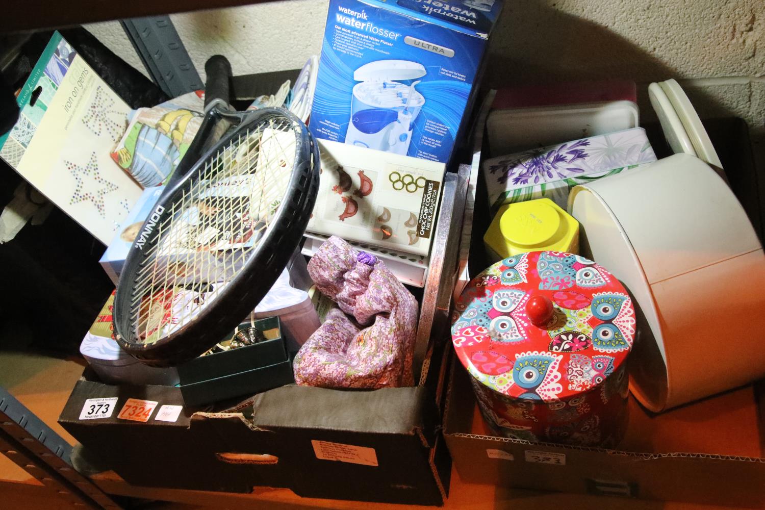 Two boxes of mixed household items including tins, granite hot plate, Rosemary Conley? exercise