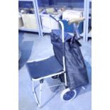 Shopping trolley with integral fold out seat, shopping bag is fully removable and rubber tipped