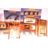 Fifteen Hornby buildings and accessories including; viaduct x4, river bridge, footbridge, signals,