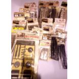 Over thirty plastic kits; coaches, trackside, signals etc all sealed in packets. P&P Group 2 (£18+