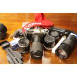 Canon AE1 camera with lenses and accessories. P&P Group 3 (£25+VAT for the first lot and £5+VAT