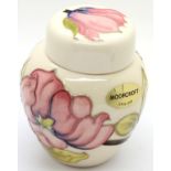 Small Moorcroft Pink Magnolia ginger jar, H: 9 cm. P&P Group 2 (£18+VAT for the first lot and £3+VAT
