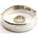Hallmarked silver snap bangle with engraved decoration. P&P Group 1 (£14+VAT for the first lot