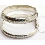 Two silver bangles, each with engraved decoration. P&P Group 1 (£14+VAT for the first lot and £1+VAT